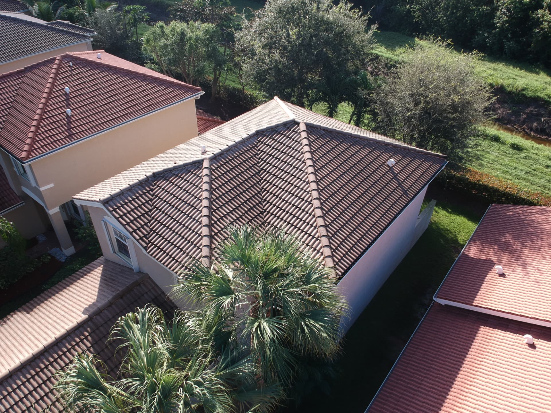 Aerial view of a completed clay-tone barrel tile roof on a South Florida residence